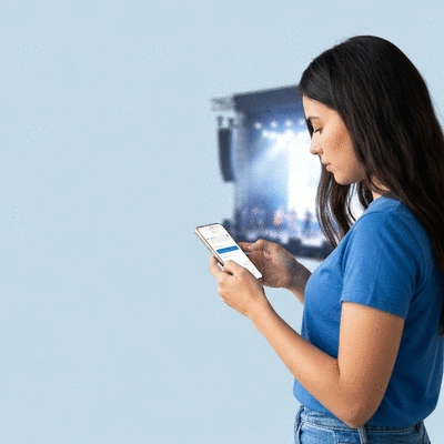 Person using a mobile phone to buy concert tickets online, with a blurred concert stage in the background